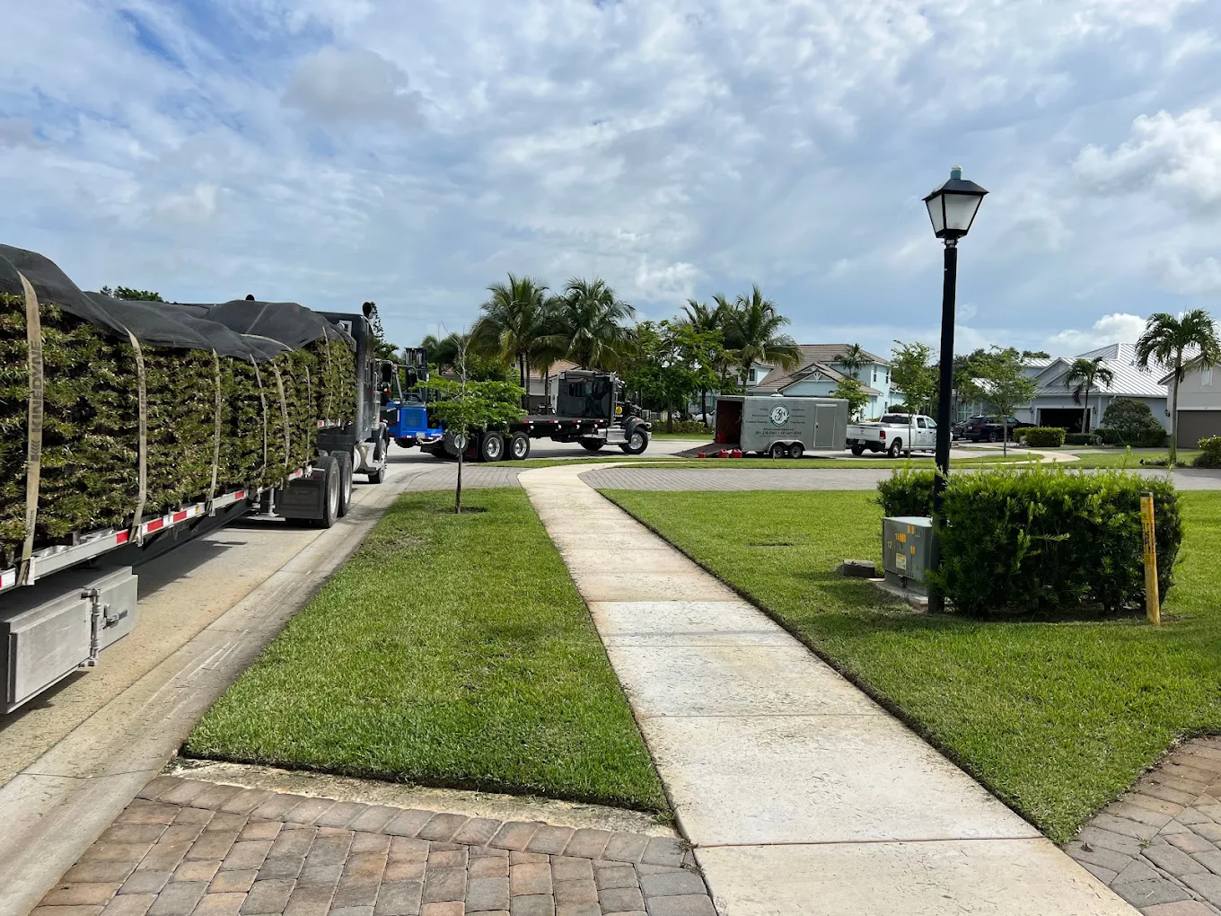 Lawn installation project with 3H equipment and trucks